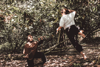 People sitting in forest