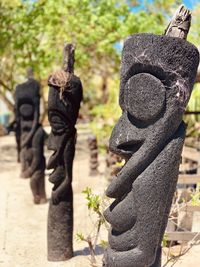 Close-up of statue against stone wall