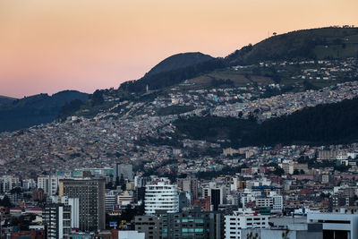 Cityscape against clear sky during sunset