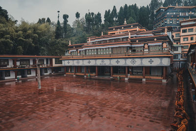 Exterior of building by trees against sky