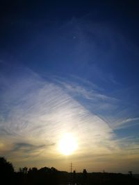 Silhouette trees against sky during sunset