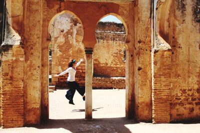 Full length of man standing in old ruin