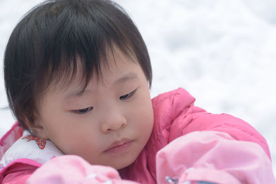 Close-up of baby girl wearing warm clothing during winter