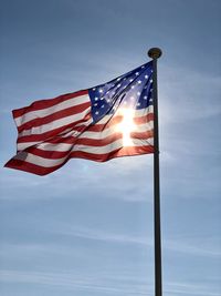 Low angle view of flag against the sky