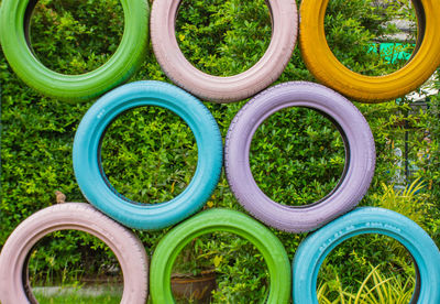 Colorful tires against trees