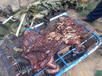 High angle view of meat on barbecue grill