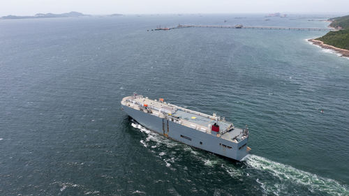 Aerial drone photo of roll on roll off vehicle carrier vessel ro ro cruising open sea