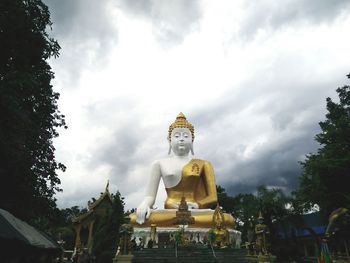 Low angle view of statue against sky