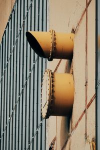 Close-up of rusty metal pipe against wall