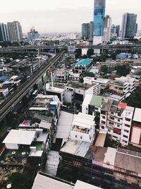 High angle view of buildings in city against sky