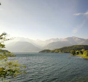 Scenic view of sea and mountains against sky