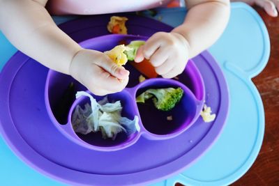 High angle view of woman eating food