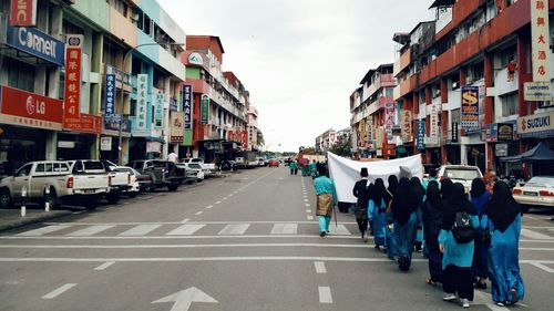 People walking on street in city