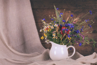 Close-up of flower pot on table