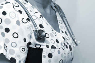 Close-up of woman wearing hat standing at home