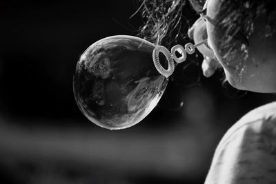 Close-up of  holding soap bubbles