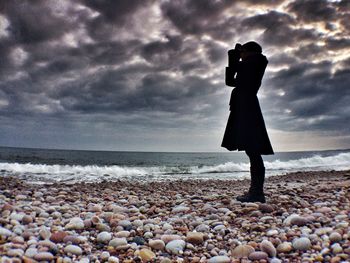 Scenic view of sea against cloudy sky