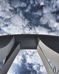 Low angle view of building against cloudy sky