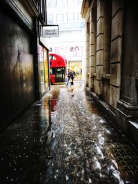 People in wet corridor