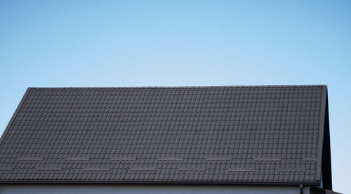 Low angle view of building against clear blue sky