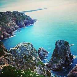 Scenic view of sea against blue sky