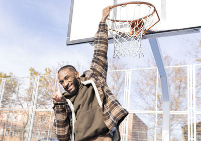 Low angle view of basketball hoop against sky