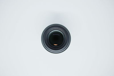 Close-up of camera against white background