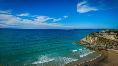 Scenic view of sea against blue sky