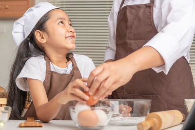 Portrait of a girl preparing food