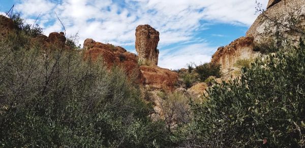 Panoramic view of rocks on landscape against sky