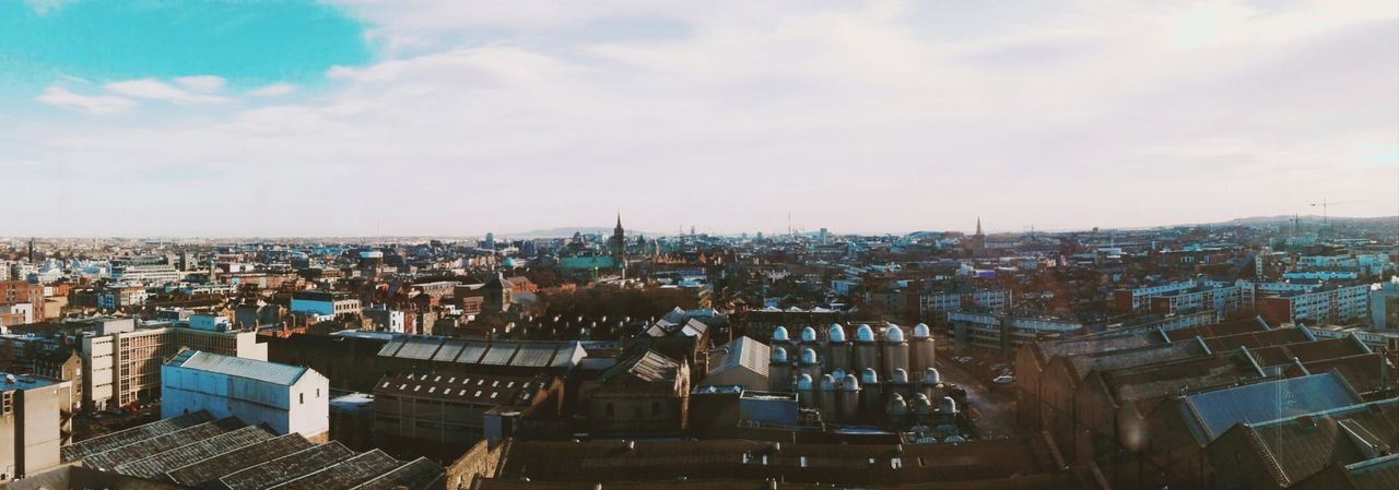 architecture, building exterior, built structure, city, sky, cityscape, high angle view, cloud - sky, building, crowd, residential district, nature, roof, crowded, day, outdoors, community, travel destinations, city life, settlement, townscape