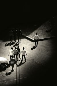 High angle view of men standing at night
