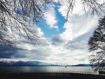 Scenic view of sea against cloudy sky