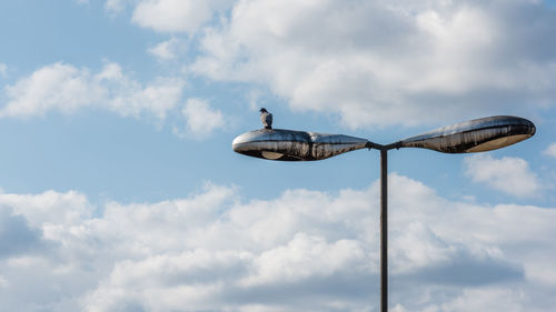 Low angle view of street light against sky