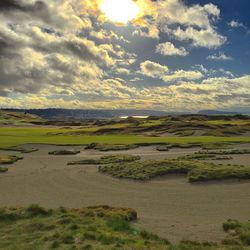 Scenic view of landscape against cloudy sky