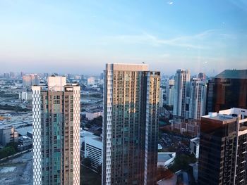 High angle view of buildings in city against sky