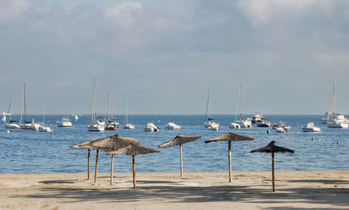 Beach with umbrellas and boats