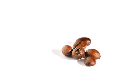 Close-up of coffee beans against white background