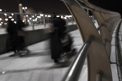 Blurred motion of people at railroad station