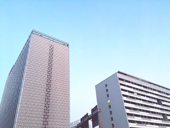 Low angle view of modern buildings against clear sky