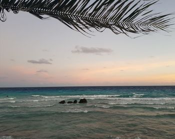 Scenic view of sea against sky at sunset