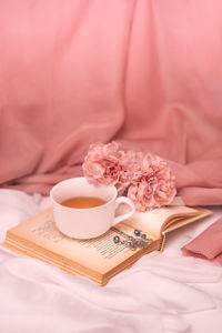 Close-up of pink roses on table