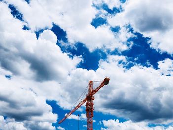 Low angle view of communications tower against sky