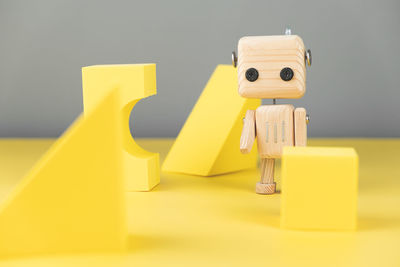 Close-up of yellow toys on table