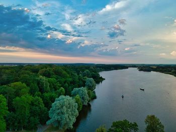 High angle view of trees by sea against sky