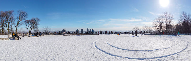 Scenic view of snow covered land against sky