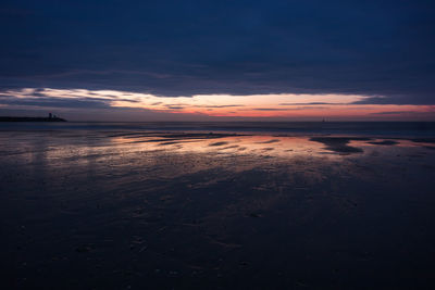 Scenic view of sea against sky at sunset