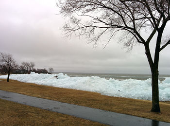 Scenic view of sea against sky during winter