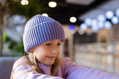 Portrait of cute girl looking away