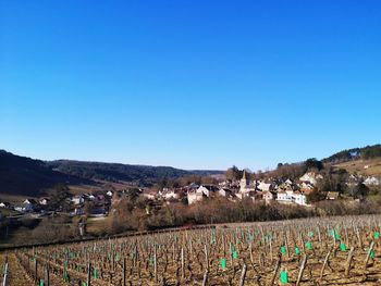 Townscape against clear blue sky